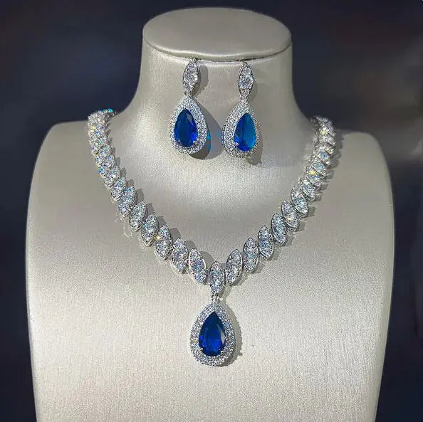 Green women necklace and earring set by Lamp Post featuring matching jewelry with elegant design.