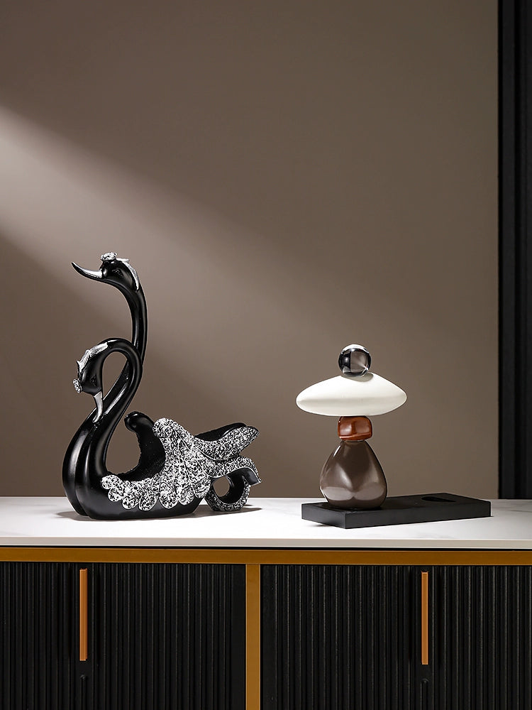 Black swan-shaped wine rack from Lamp Post, decorative home wine bottle shelf for classy dining table or side cabinet.