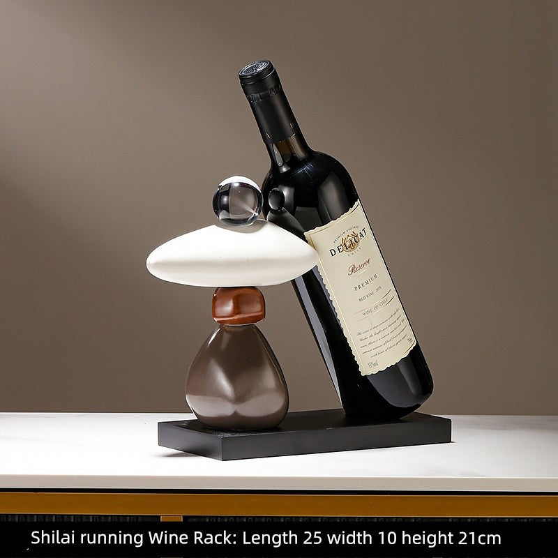 Black Swan wine rack decoration by Lamp Post, stylish home decor for dining tables and wine cabinets, holds red wine bottles.