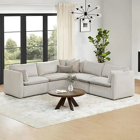 Cream modular down-filled L-shaped sectional sofa by Lamp Post, perfect for living room corner seating and modern home décor.