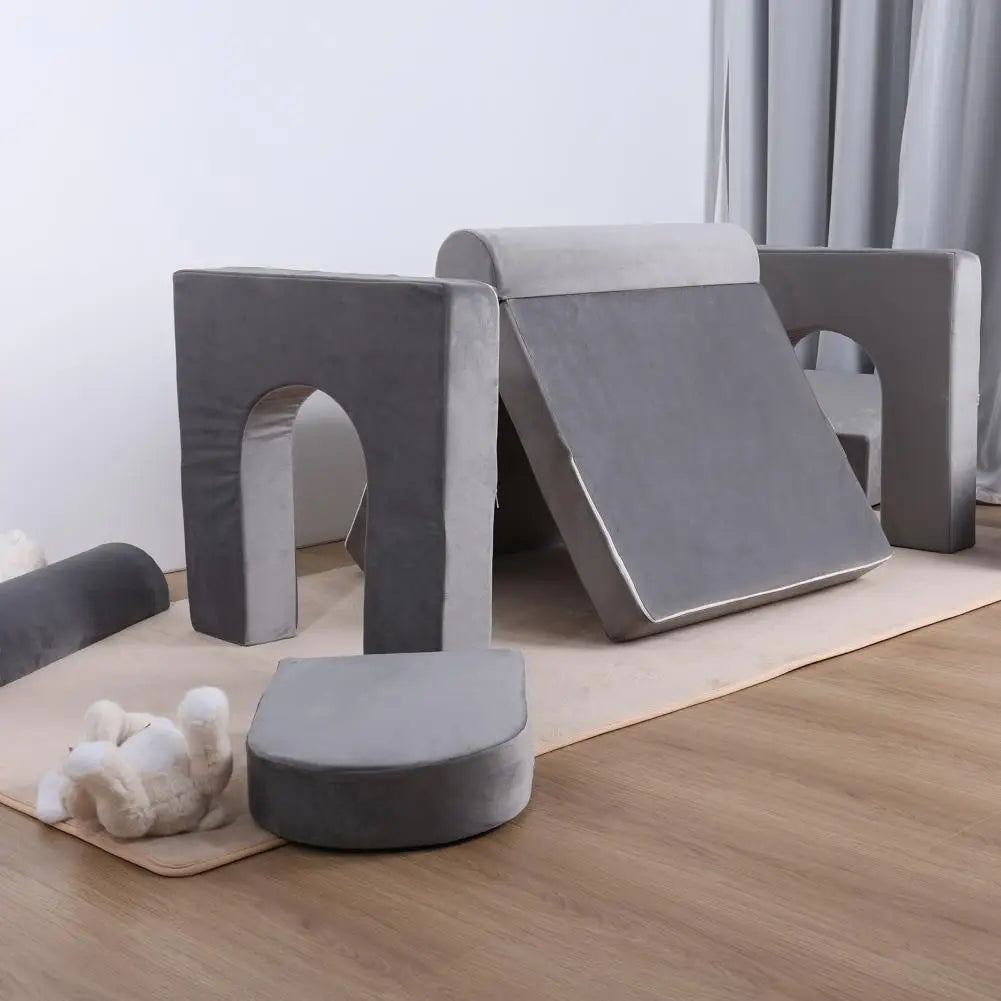 Dark gray Kid Couch by Lamp Post, a modular play sofa for children with detachable sections, suitable for kids' playroom or lounge area.