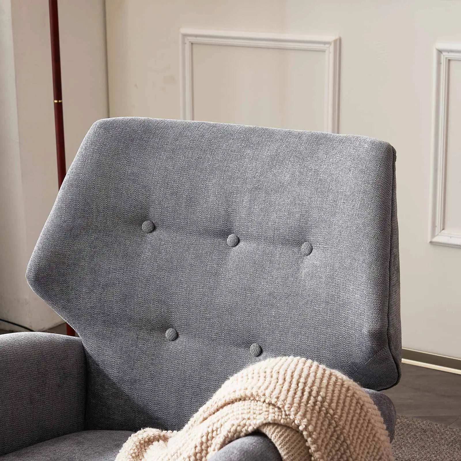 Light grey reading chair with wooden legs from Lamp Post, part of a home sofa set, ideal for living room relaxation.
