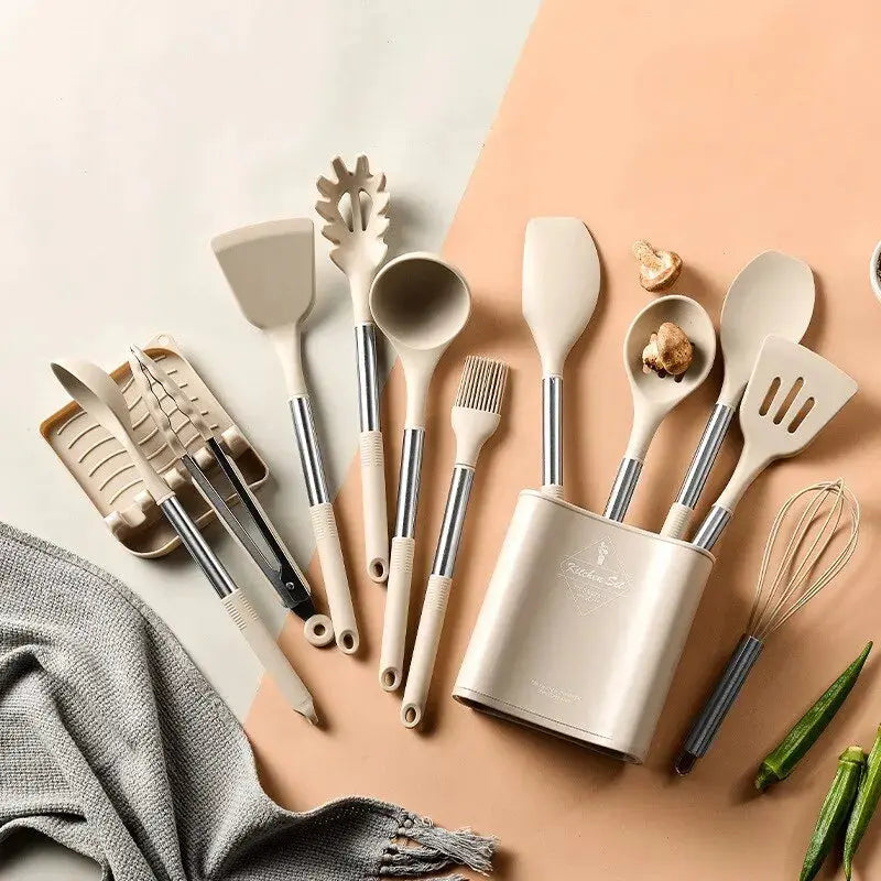 13-piece Lamp Post silicone kitchen utensil set with steel handles in a storage bucket, including spoons, spatulas, and tongs.