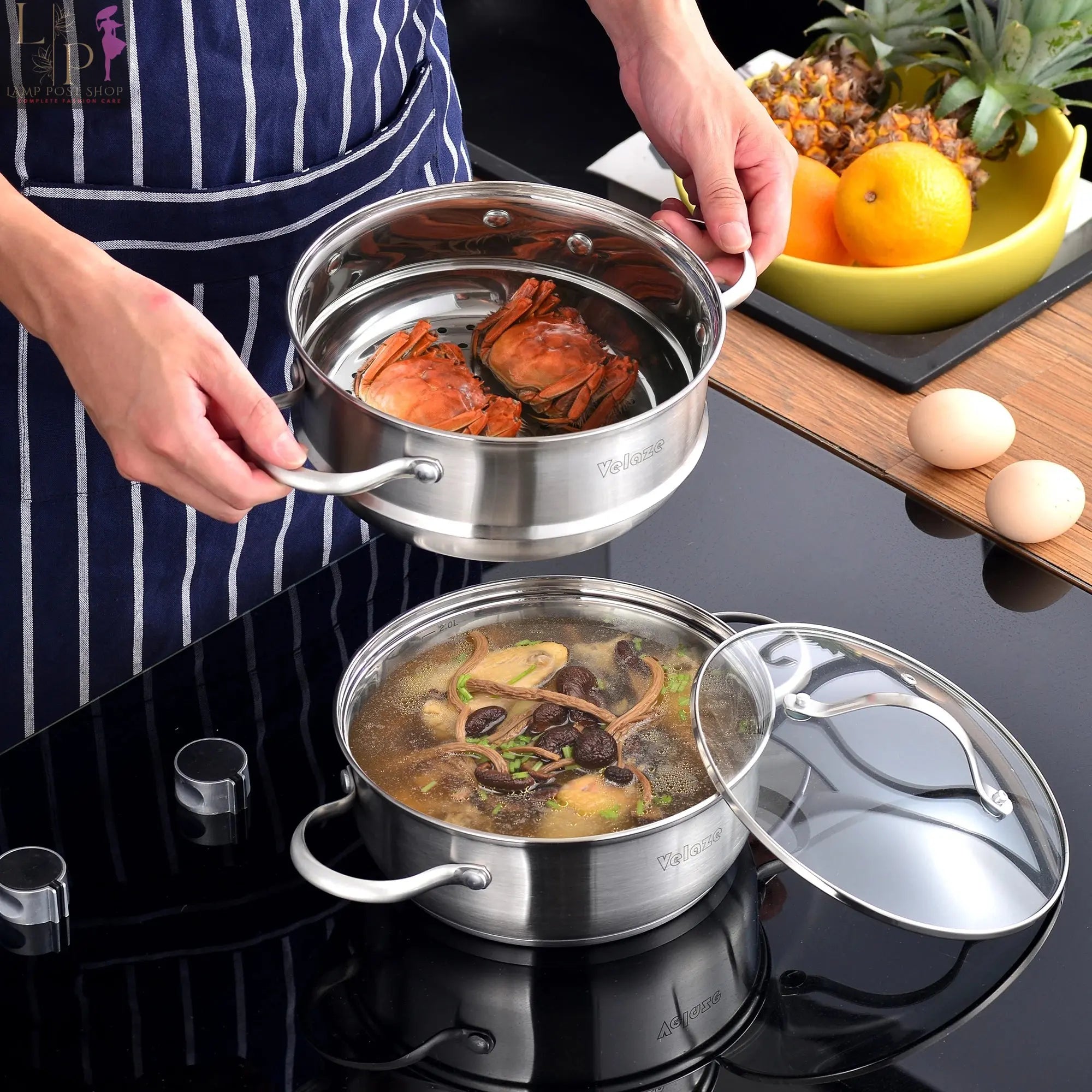 Lamp Post Velaze stainless steel cookware set with 8, 9, or 14 pieces, induction safe kitchen appliances displayed in a modern kitchen.