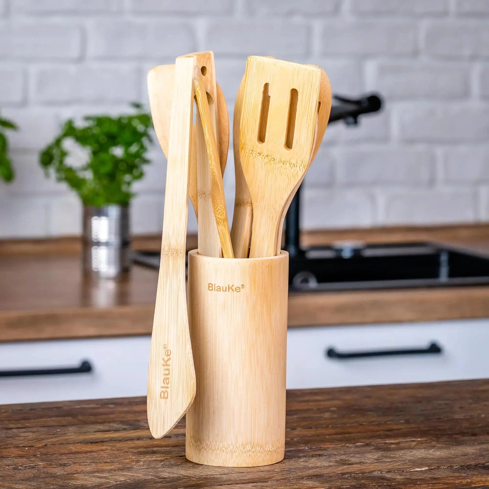 Lamp Post bamboo kitchen utensils set with 8 nonstick wooden cooking tools displayed on a countertop.