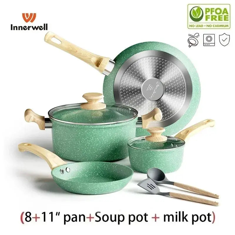 Lamp Post nonstick 8-piece cookware set with lids including frying pan, stockpot, and milk pot, all in pink for versatile kitchen use.