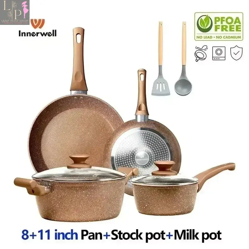 Lamp Post 8-piece nonstick cookware set with lids, including frying pan, stockpot, and milk pot, in pink kitchen appliances.