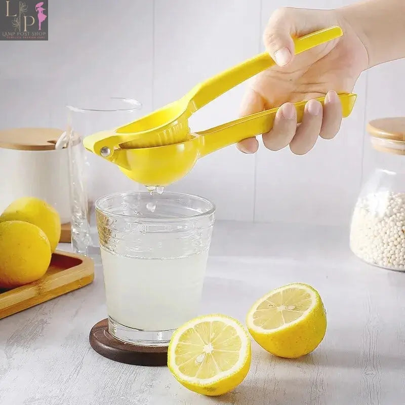 Yellow aluminum alloy lemon squeezer for citrus fruits, hand-pressed lemon juicer from Lamp Post, kitchen appliances.