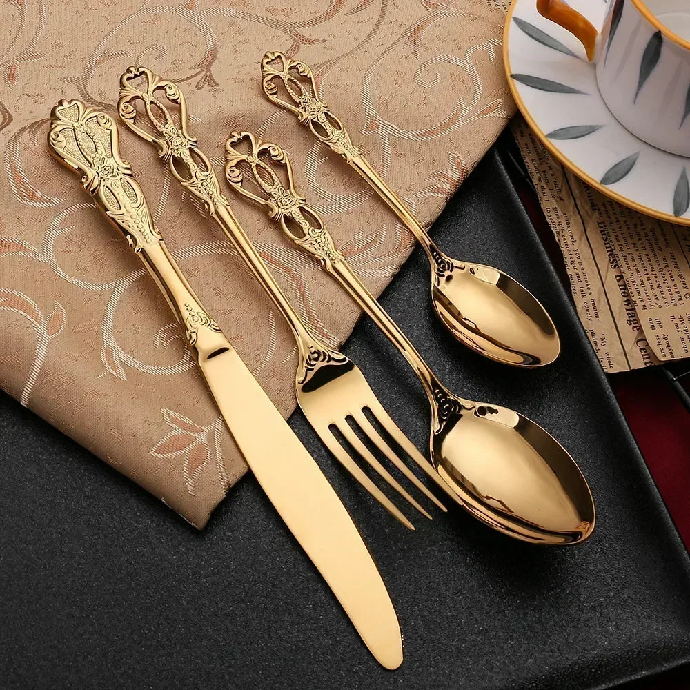 Golden stainless steel cutlery set by Lamp Post, 24-piece complete tableware set with knives, forks, and spoons on a kitchen dishware box.