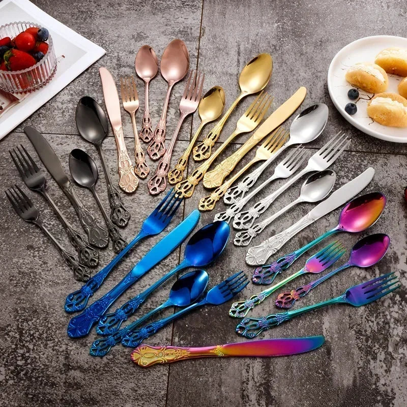 Golden stainless steel cutlery set from Lamp Post, including forks, knives, and spoons in a 24-piece complete tableware set.