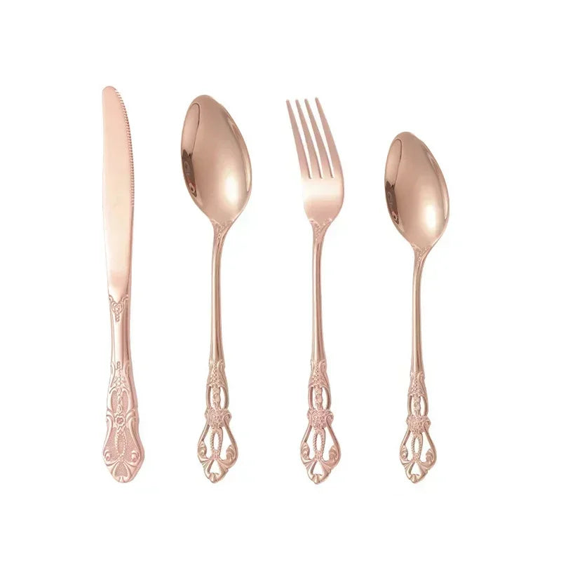 Golden stainless steel cutlery set by Lamp Post, complete 24-piece kitchen dishware with forks, knives, and spoons arranged on a table.