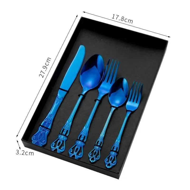 Golden stainless steel cutlery set from Lamp Post, 24-piece complete tableware including forks, knives, and spoons on a kitchen dishware background.