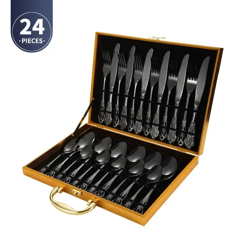 Golden stainless steel cutlery set by Lamp Post, complete 24-piece kitchen dishware including forks, knives, and spoons on a table.