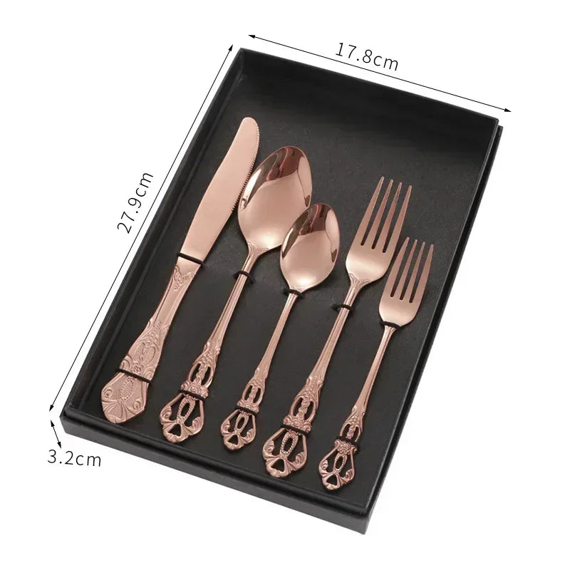 Golden stainless steel cutlery set by Lamp Post, complete 24-piece kitchen dishware with forks, knives, and spoons displayed in a box.
