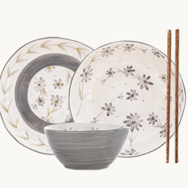 Lamp Post ceramic dining set with full dish cookware, including plates, bowls, and mugs, arranged on a dining table.