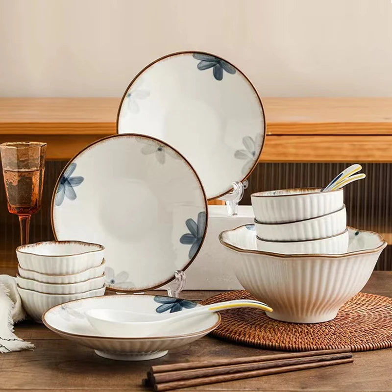 Lamp Post kitchen dishware full dining set featuring matching plates, bowls, and mugs arranged on a wooden table.