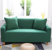 Lavender colorful sofa covers by Lamp Post draped over a sofa, showcasing vibrant, protective fabric with floral patterns.