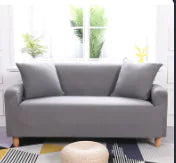 Lavender colorful sofa covers by Lamp Post draped over a sofa, showcasing vibrant, decorative fabric for home protection and style.