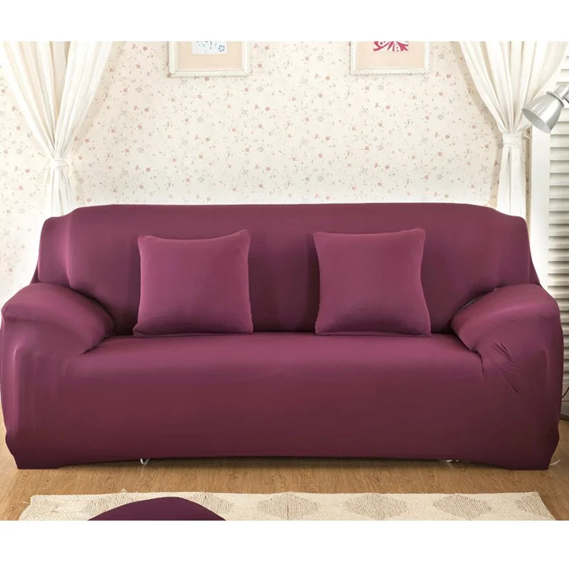 Lavender colorful sofa covers by Lamp Post draped over a sofa, showcasing vibrant and decorative fabric.