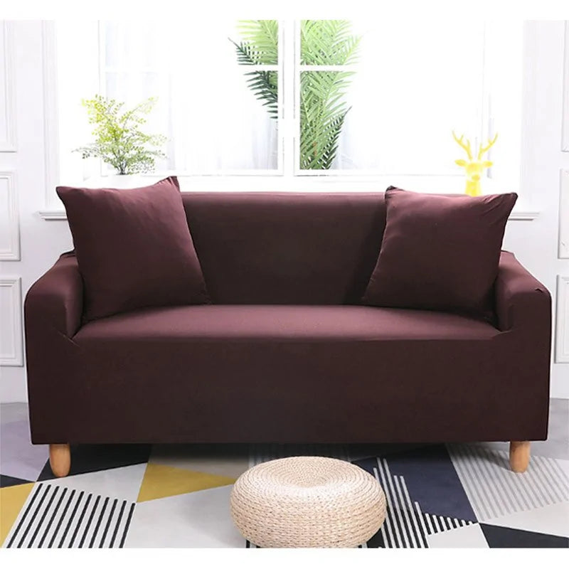 Lavender colorful sofa covers by Lamp Post draped over a sofa, showcasing vibrant, protective fabric with a playful design.