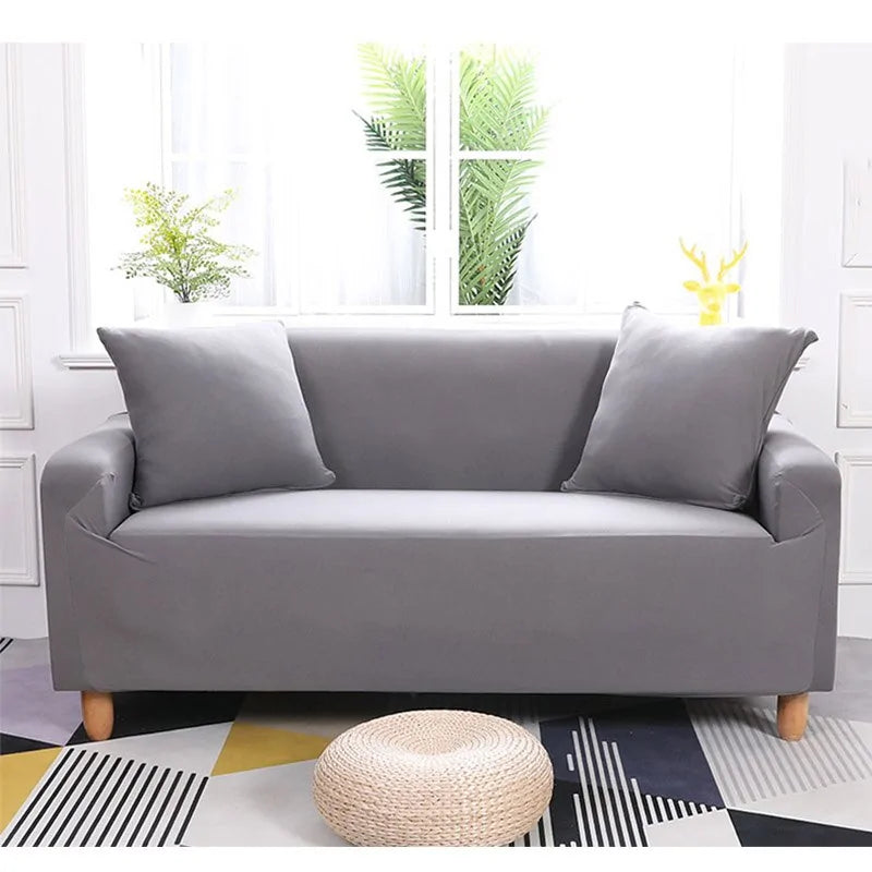 Lavender colorful sofa covers from Lamp Post, showing vibrant, patterned fabric draped over a sofa for a stylish look.