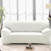 Lavender-colored Lamp Post sofa covers draped over a sofa, showcasing vibrant, colorful protective slipcovers for furniture.