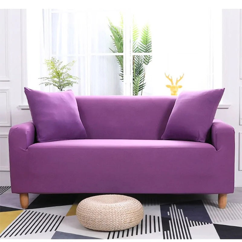 Lavender-colored Lamp Post sofa covers on a colorful, patterned sofa, showcasing vibrant fabric and stylish home decor.