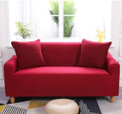 Lavender colorful sofa covers by Lamp Post draped over a sofa, showcasing vibrant, decorative fabric for home decor.