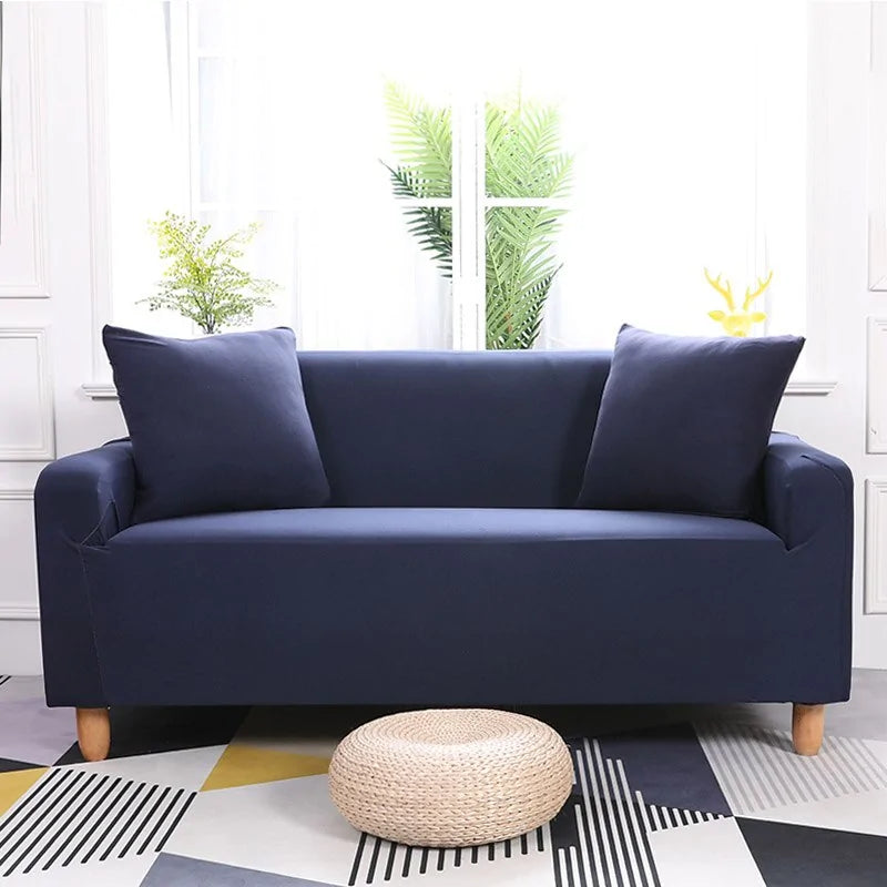 Lavender colorful sofa covers by Lamp Post draped over a sofa, showcasing vibrant, protective fabric with a lively, decorative pattern.
