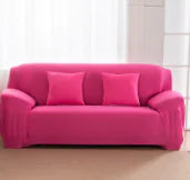 Lavender colorful sofa covers by Lamp Post, showcasing vibrant, soft fabric draping over a sofa for a stylish home decor update.