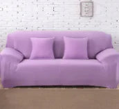 Lavender colorful sofa covers by Lamp Post shown on a sofa, featuring vibrant, patterned fabric for stylish home decor.
