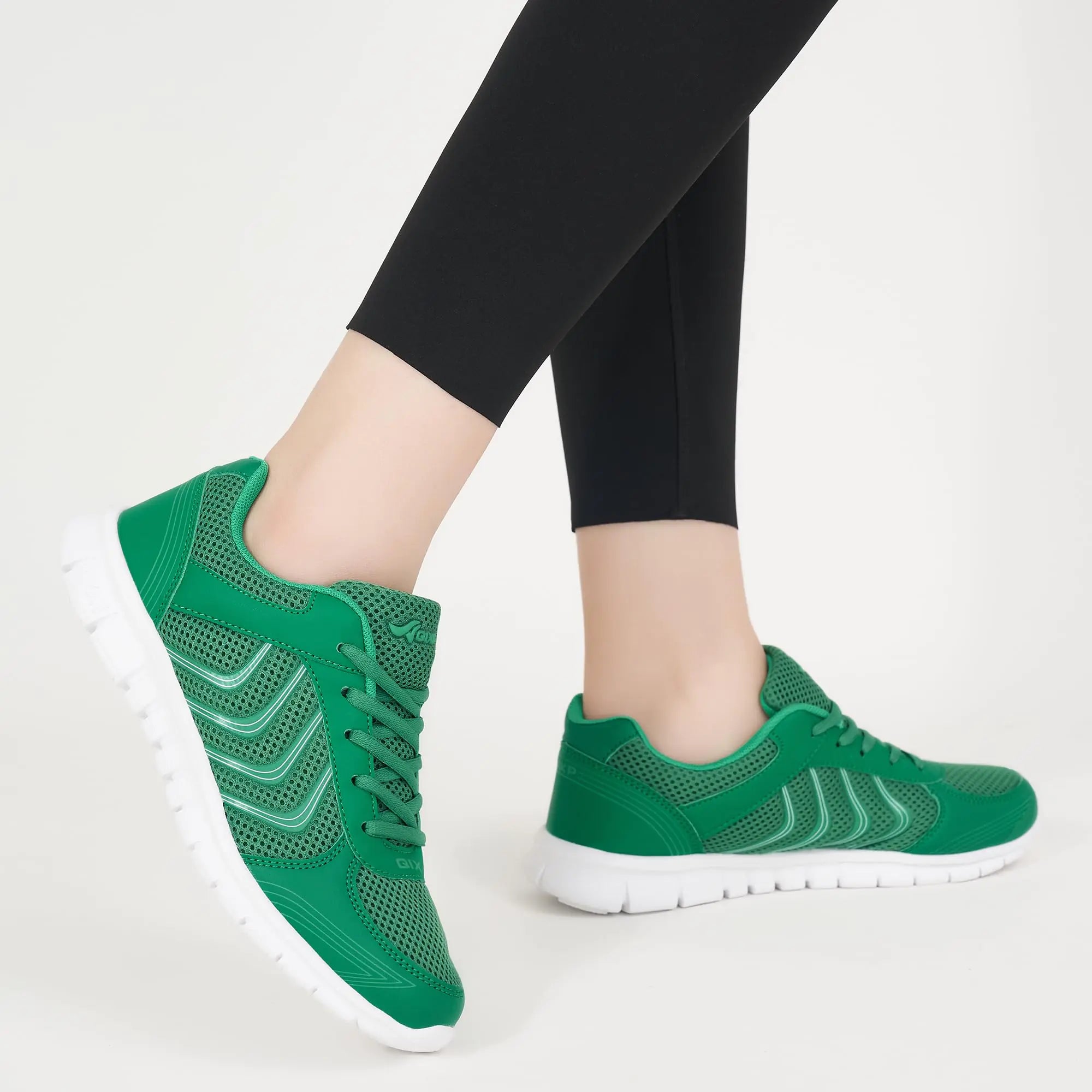 Light green Lamp Post women's running sneakers with breathable mesh and cushioned soles, designed for comfort and performance.