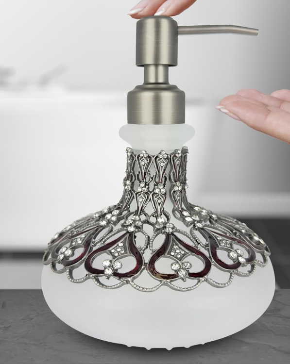Elegant frosted glass lotion dispenser by Lamp Post, with an arabesque design, perfect for bathroom decor and gifting.