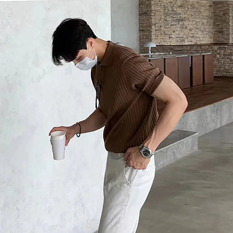 Black men's luxury knitted polo shirt from Lamp Post, 2023 men's dress clothing, stylish and comfortable for formal or casual wear.