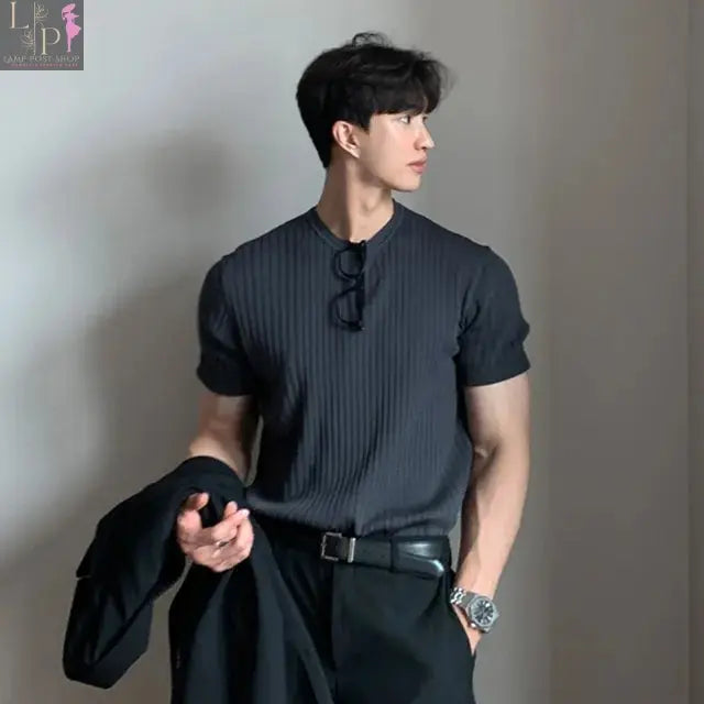 Black luxury knitted polo shirt for men by Lamp Post, stylish 2023 men's dress clothing, medium size, close-up view.