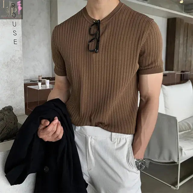 Black men's luxury knitted polo shirt by Lamp Post, stylish men's dress clothing for 2023, medium size, close-up view.