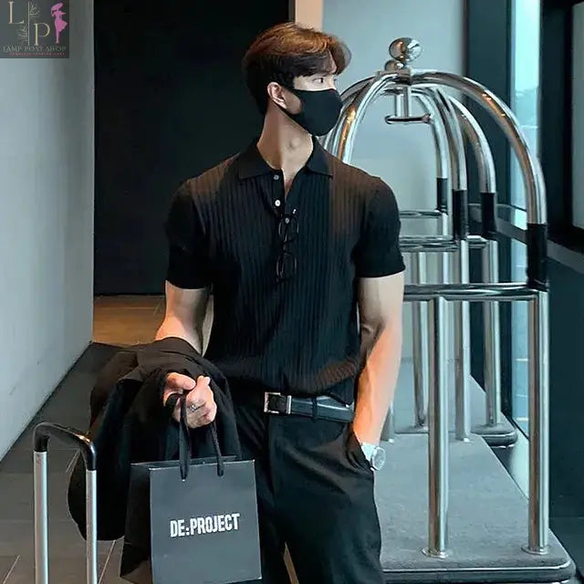 Men's black luxury knitted polo shirt from Lamp Post, stylish 2023 men's dress clothing with a classic fit.