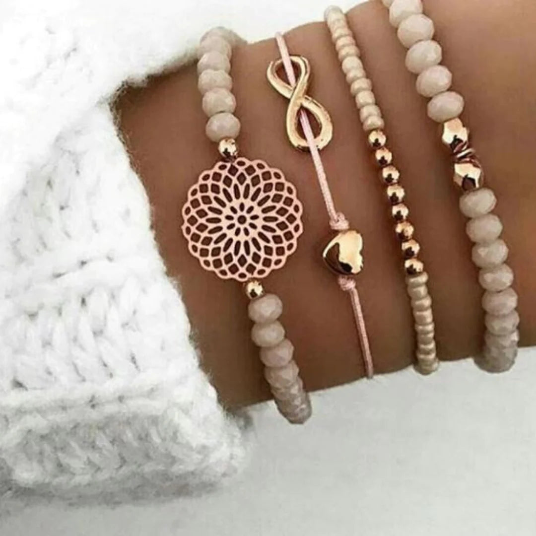 Women bracelet set by Lamp Post featuring multiple stylish silver bangles and charms on a neutral background.