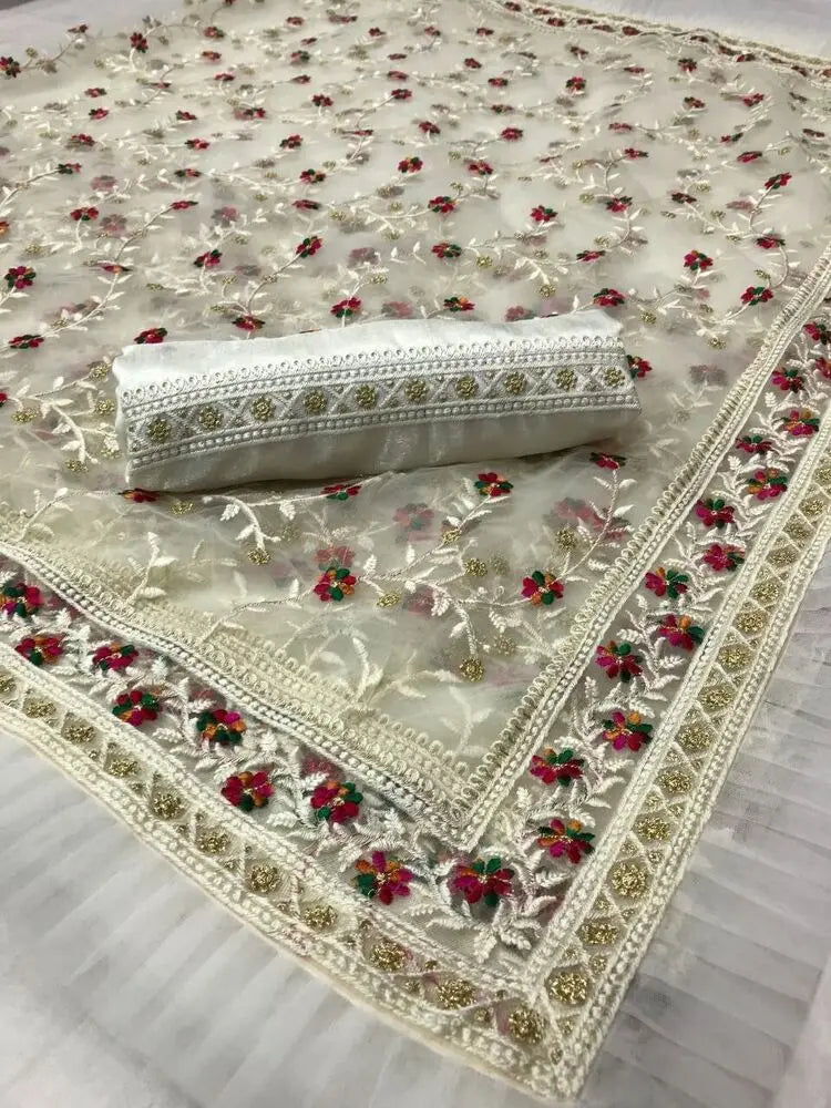One-size traditional Indian saree with intricate embroidery and printing by Lamp Post, showcasing colorful traditional embroidery details.