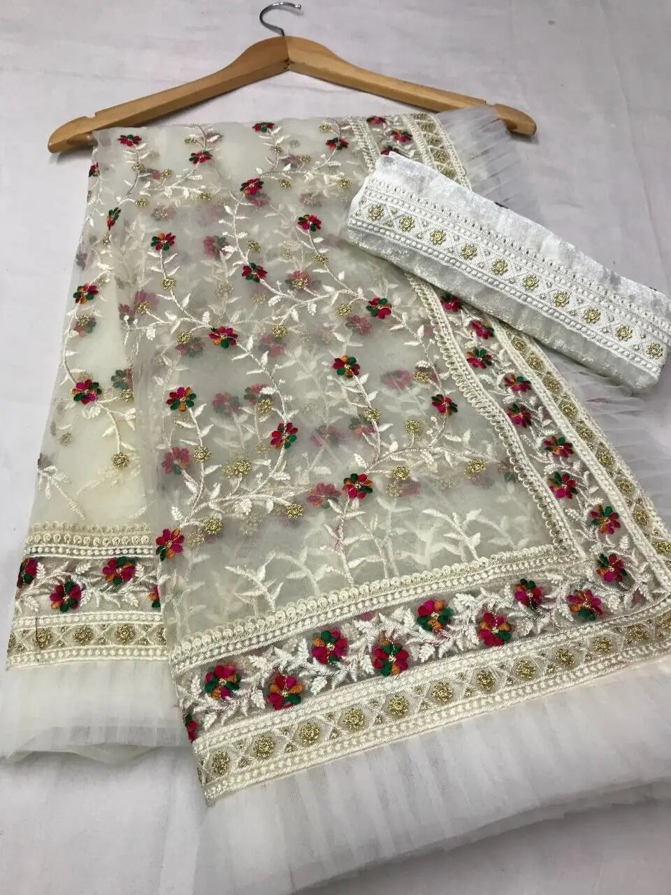 Traditional Indian saree with intricate embroidery and printing by Lamp Post, showcasing vibrant craftsmanship and elegant design.