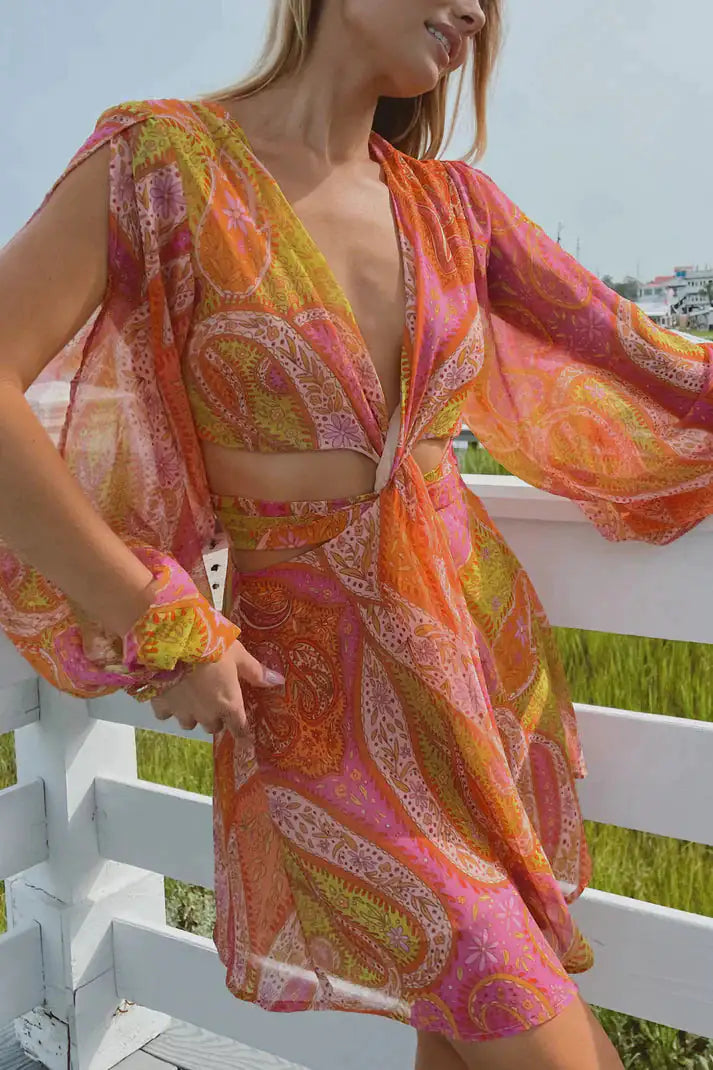 Orange summer dress for women by Lamp Post, lightweight and sleeveless, shown on a model outdoors.