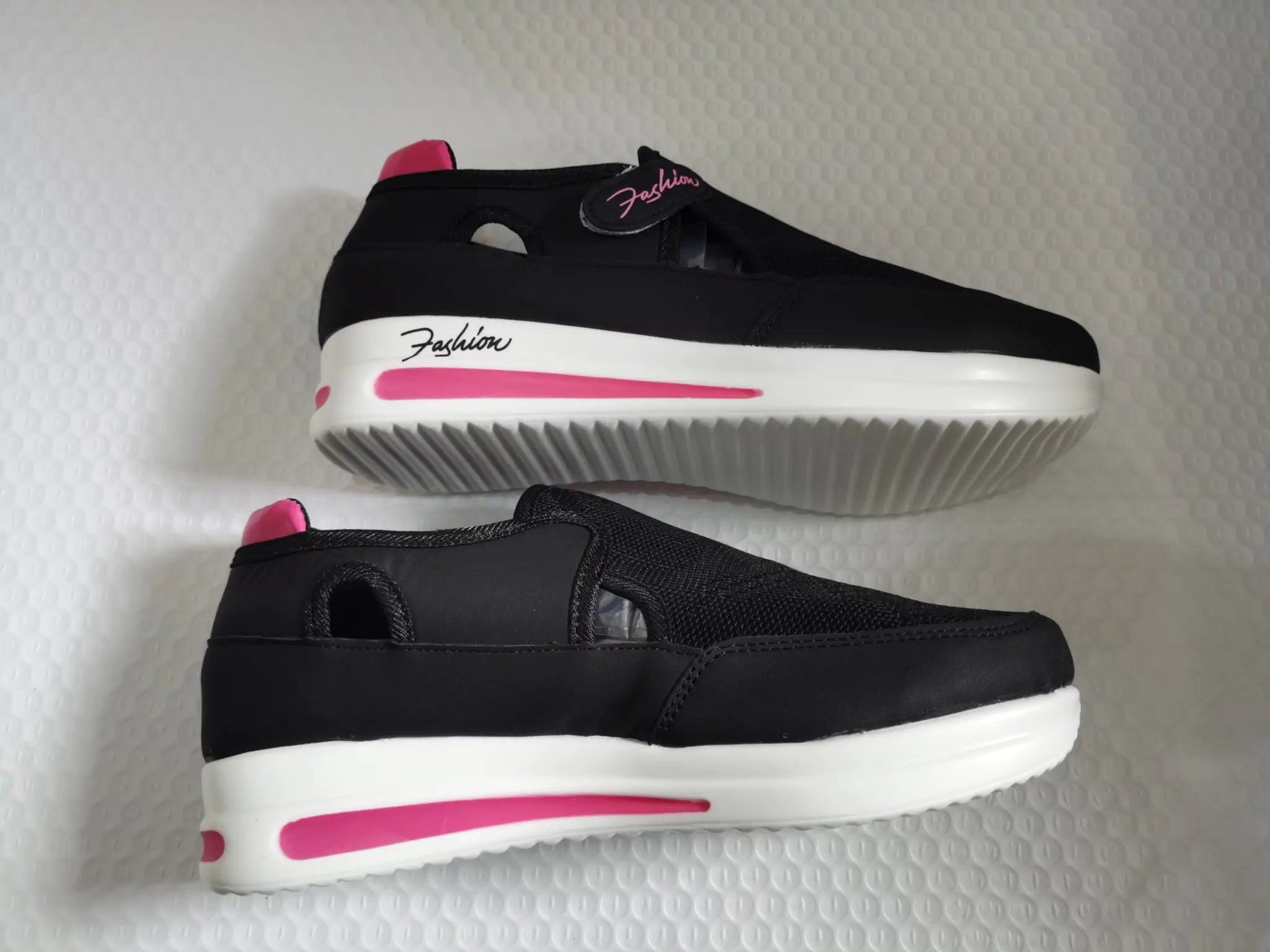 Pink Lamp Post women's sneakers with white soles, showing stylish casual footwear for women in a close-up view.