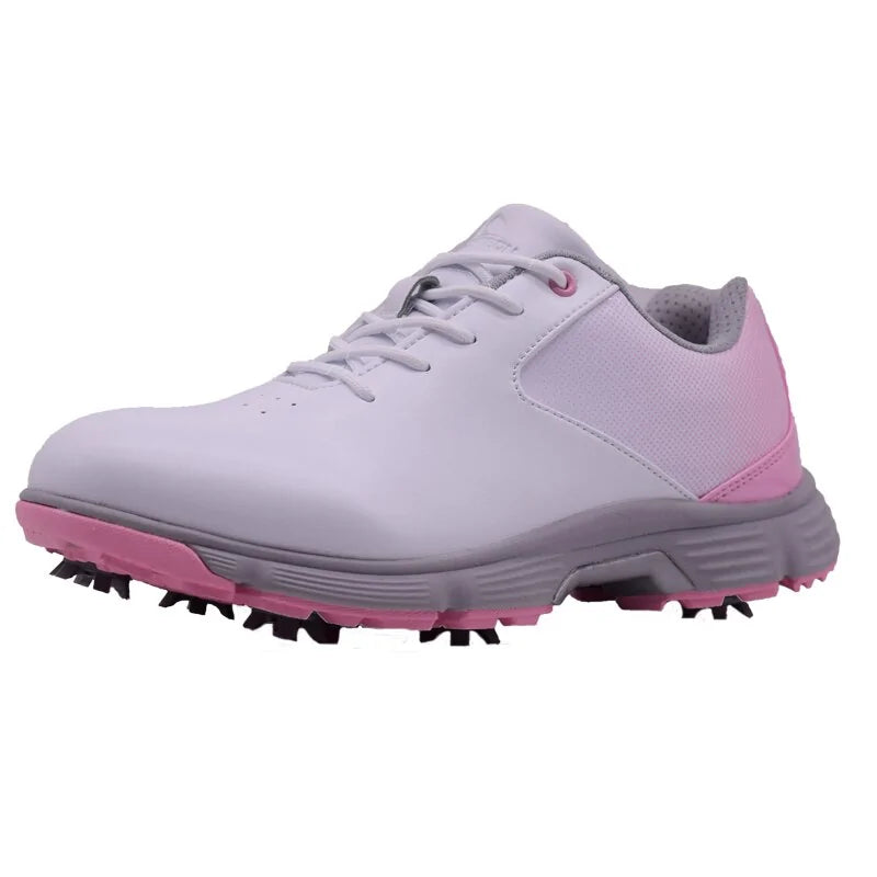 Pink women's outdoor spikes golf sneakers by Lamp Post featuring breathable fabric and spiked soles for improved traction on the course.