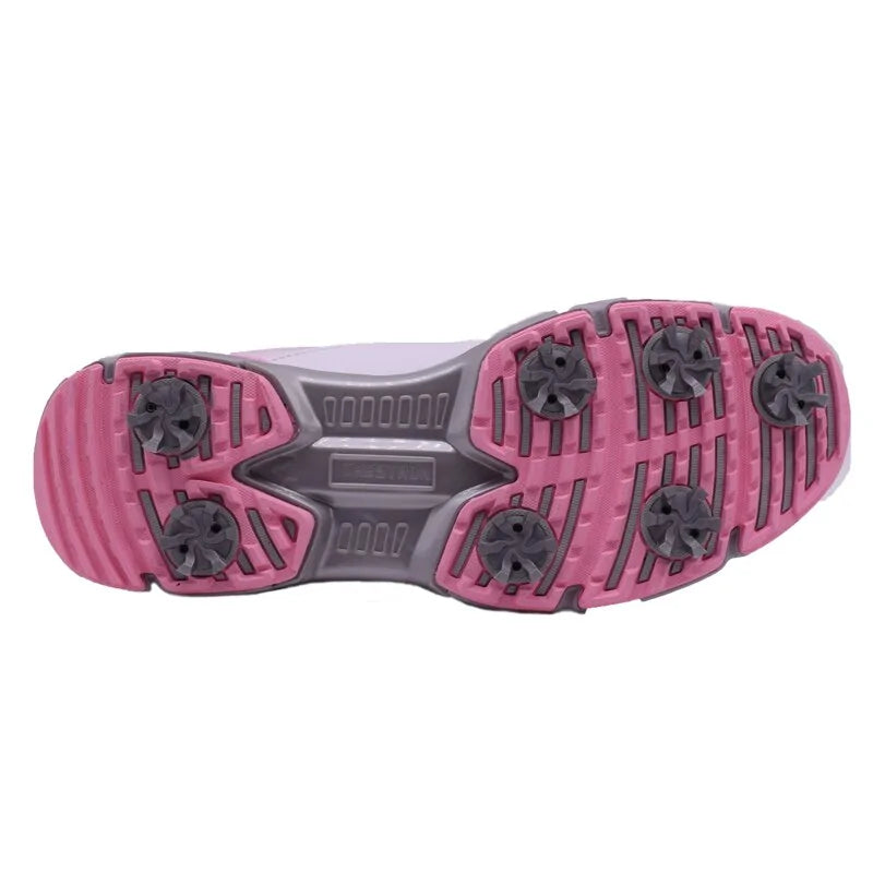 Pink women's outdoor spikes golf sneakers by Lamp Post with breathable mesh and durable rubber sole for golf course traction.