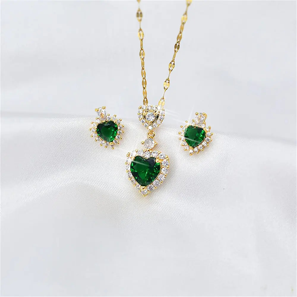 Women’s crystal jewelry set featuring pink heart-shaped accents by Lamp Post, includes matching necklace and earrings.