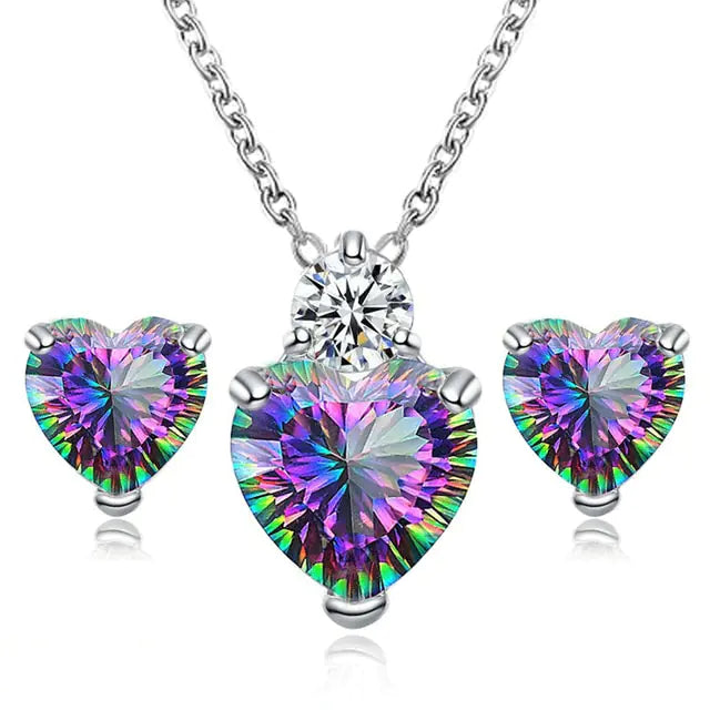 Women’s crystal jewelry set with pink heart pendant and matching earrings, by Lamp Post, elegant and sparkling accessory for women.