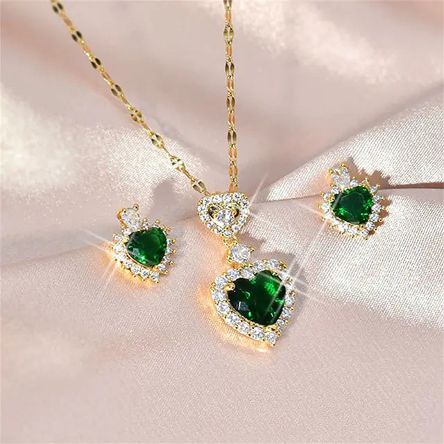 Women’s Crystal Jewelry Set by Lamp Post featuring pink heart-shaped earrings and a matching necklace with sparkling crystals.
