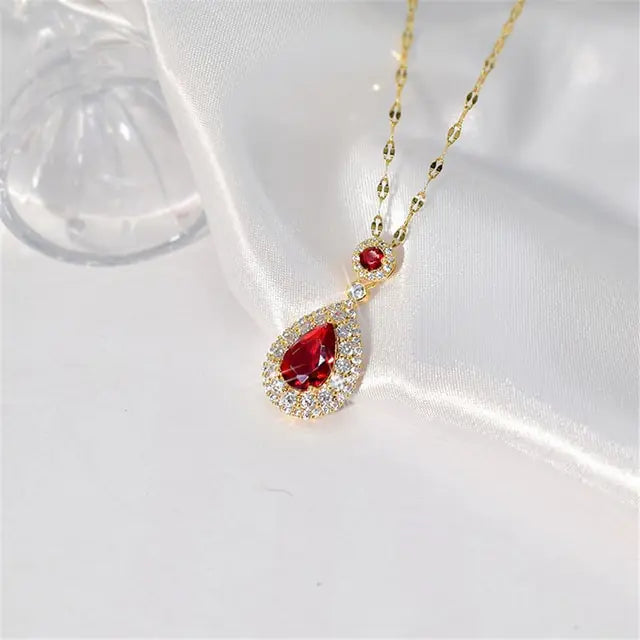 Women’s crystal jewelry set with pink heart accents by Lamp Post, featuring earrings and a matching necklace for elegant style.