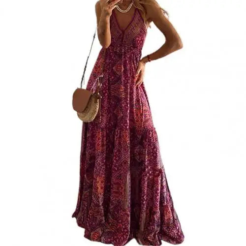 Red long dress for women by Lamp Post, flowing and elegant, shown on a model in a natural outdoor setting.