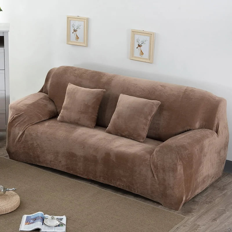 Red stretch sofa slipcover by Lamp Post on a single-seat sofa, featuring a fitted design and smooth fabric.